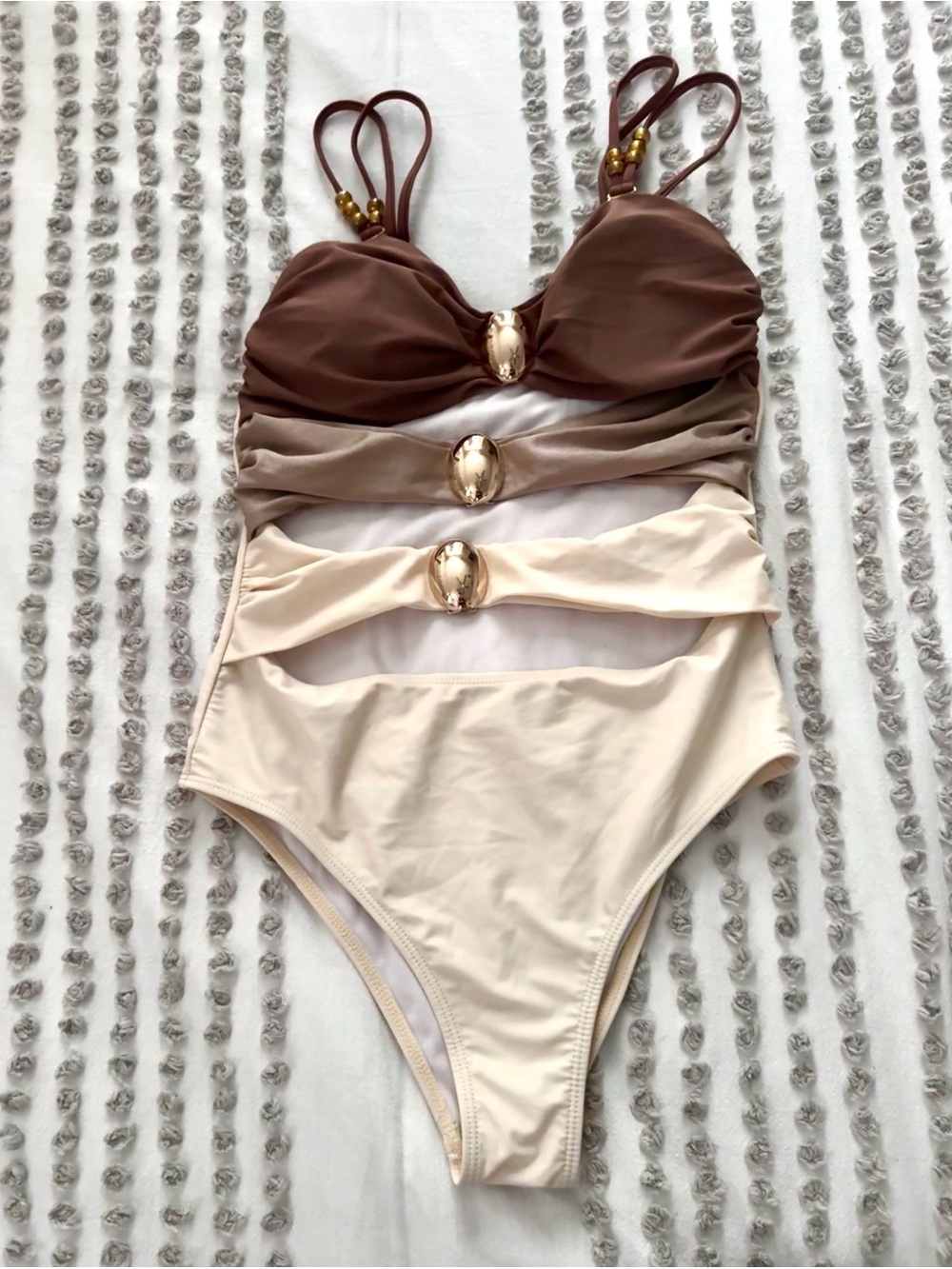 Neutral Ombre One-Piece Swimsuit with Gold Accents and brown skirt cover up